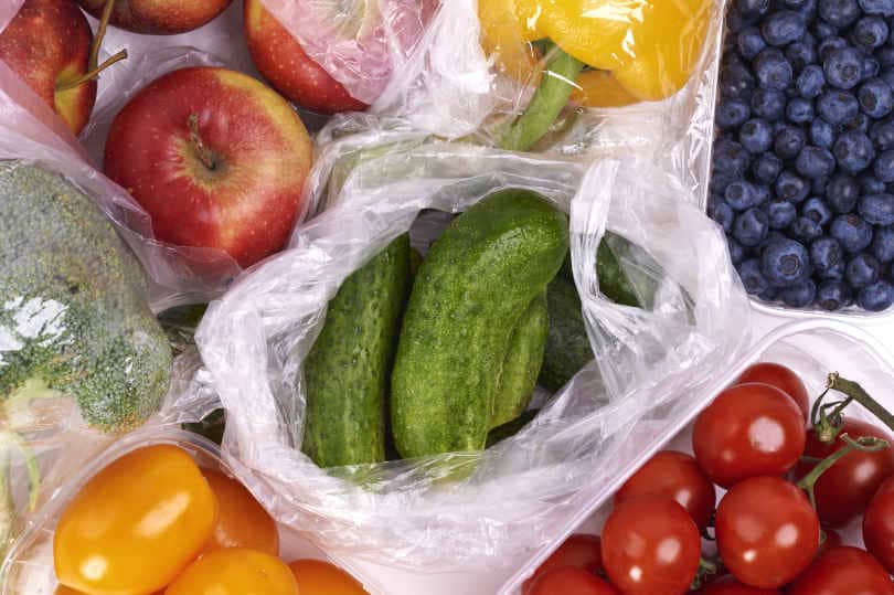 Grocery bags of fruits and vegetables