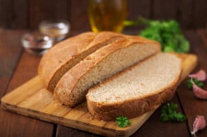 Homemade wholemeal bread sliced on wooden board