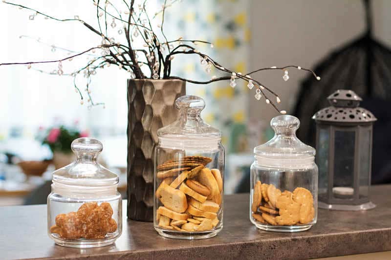 Glass jars with various cookies and crackers