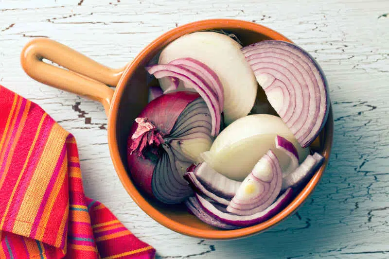 Leftover chopped onion in ceramic pan