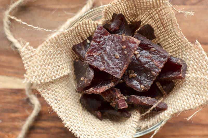 Pieces of homemade beef jerky kept on a bowl