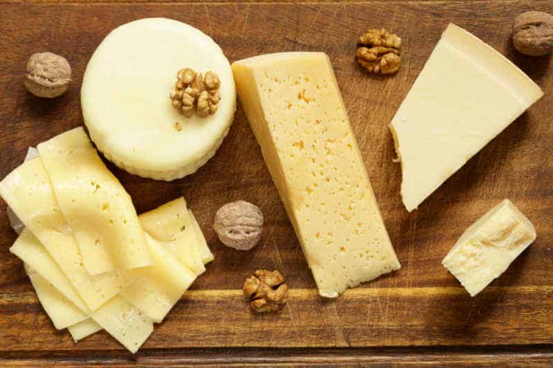 Fresh natural assorted cheese board with aromatic pears
