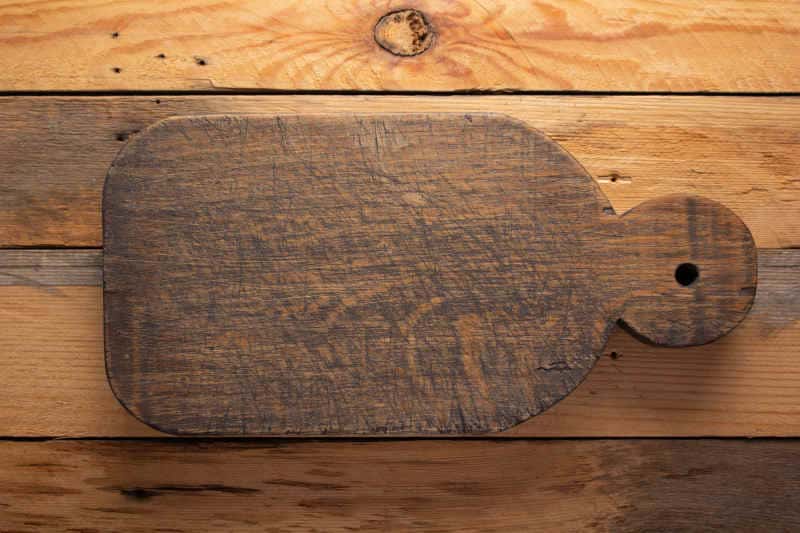 Wood cutting board at wooden background top table