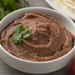 Bowl with Mexican brown refried beans paste