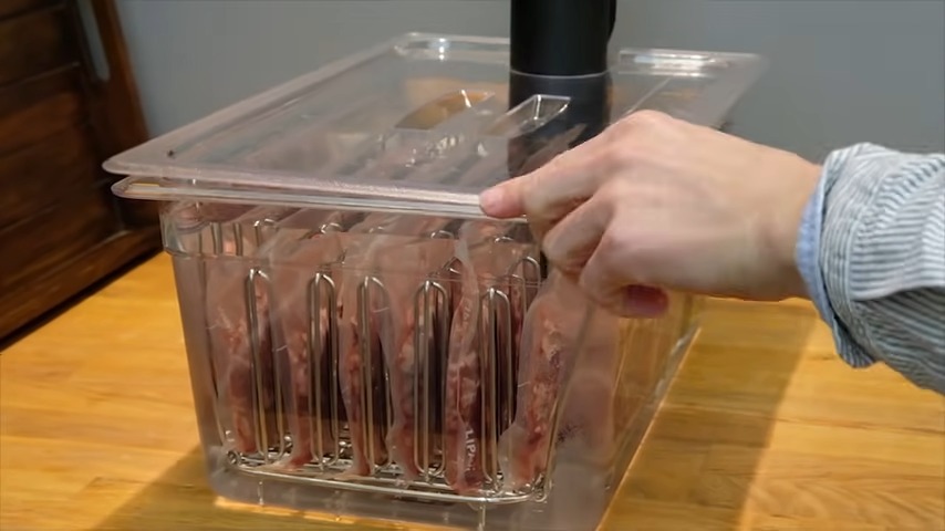 Chef covering sous vide container