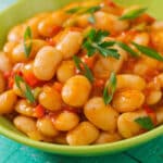 Steamed white beans with vegetables in tomato sauce