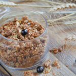 Granola, berries and ears of wheat and oats. Healthy food.
