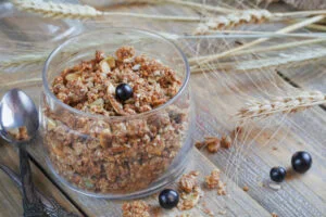 Granola, berries and ears of wheat and oats. Healthy food.