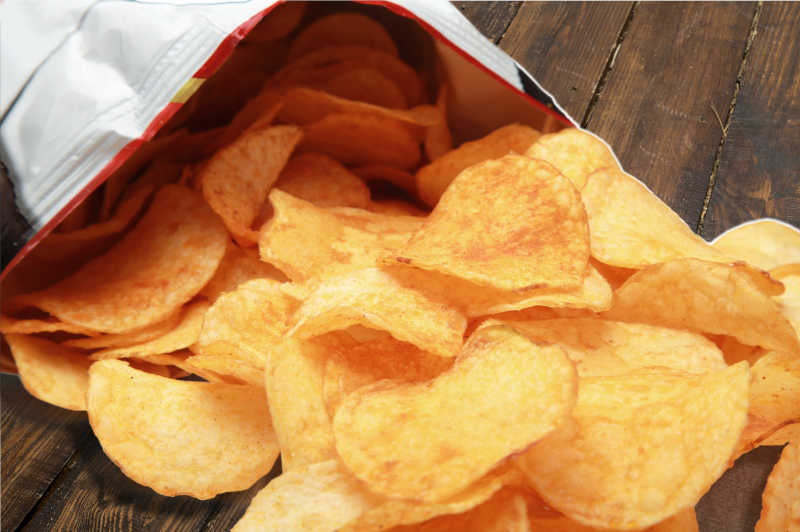 Potato chips in a vacuum sealed bag opened earlier