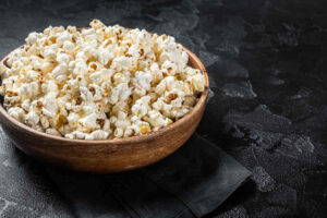 Salted popcorn in a wooden plate