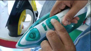 Checking the safety option before ironing clothes