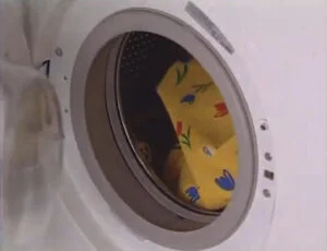 Putting ironing board cover in washing machine
